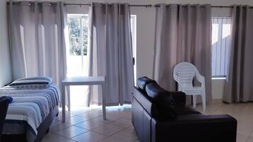 Standard Apartment, 1 Bedroom | Living area | Flat-screen TV