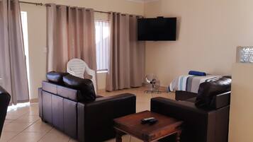 Standard Apartment, 1 Bedroom | Living room | Flat-screen TV