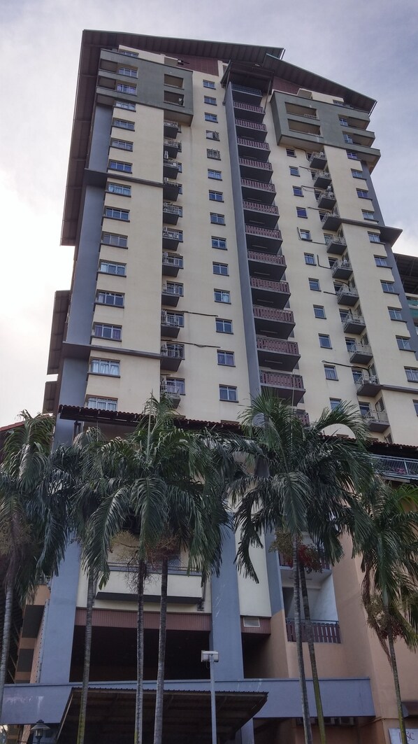 A multi-story residential building with balconies and a flat roof. - Couchbee at Perdana Exclusive Condominium (Petaling Jaya)
