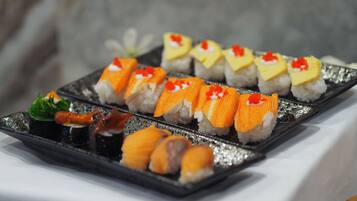 A tray of sushi on a table.