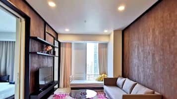 1 Bedroom Spectacular Suite with KLCC View | Living area | LED TV