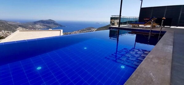 Outdoor pool, pool umbrellas, sun loungers