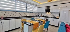Villa | Private kitchen | Full-size fridge, microwave, oven, stovetop