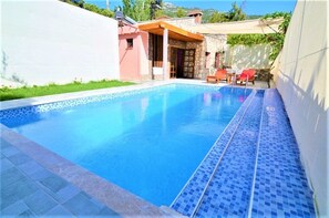 Outdoor pool, pool umbrellas, pool loungers