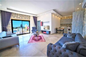 Villa | Living area | Flat-screen TV