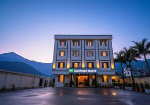 A hotel with a modern facade, multiple windows, and a sign reading 'Vaishnodevi Heights.' - Hotel Vaishno Devi Heights (Reasi)