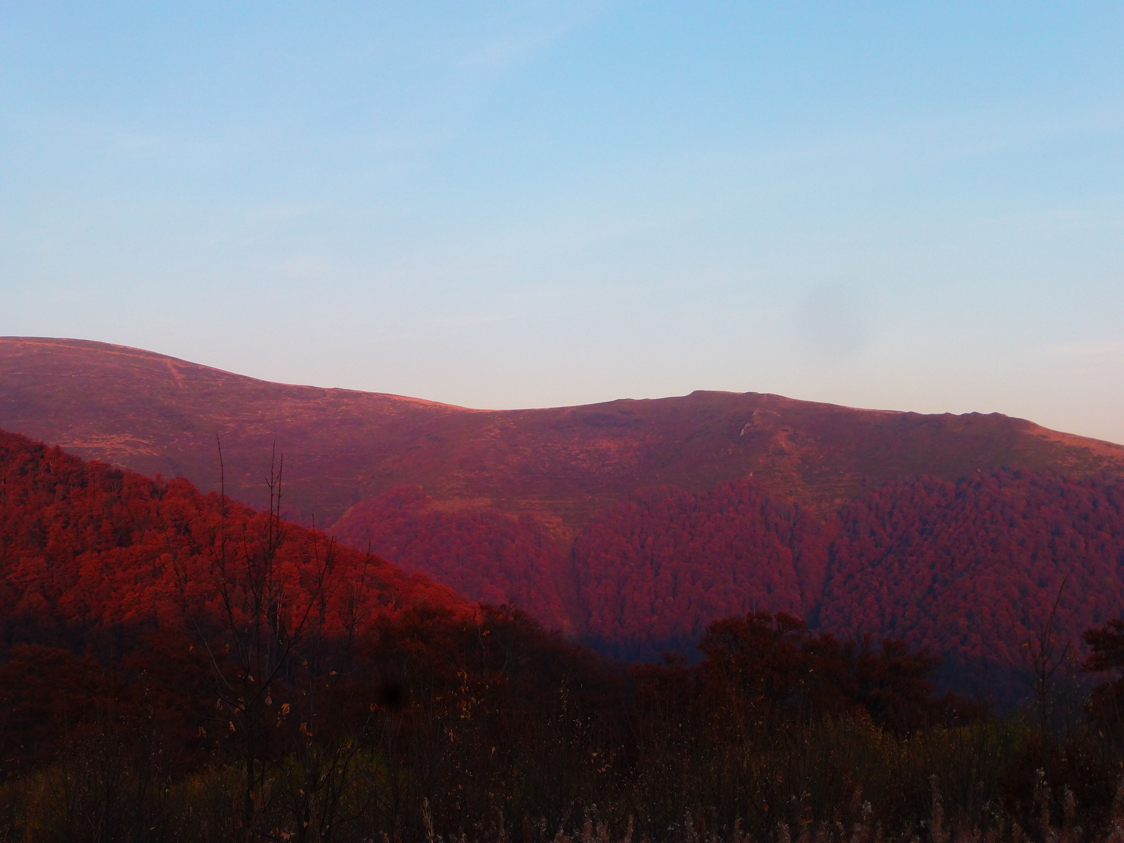A mountainous landscape with a clear sky.