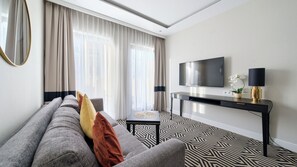 Apartment (G305) | Living area | Flat-screen TV