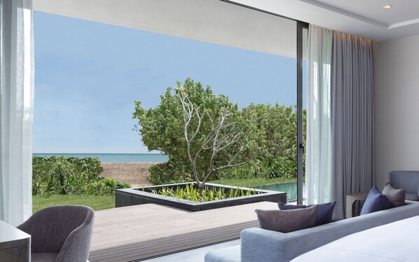 A modern living room with a view of the sea, a large window, and a minimalist design. - Anantara Desaru Coast Resort & Villas (Bandar Penawar)