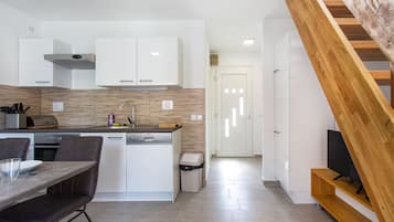 Casa Confort | Área de sala de estar | Televisión de pantalla plana