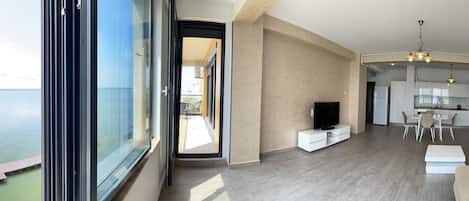Deluxe Apartment | Living area | 81-cm LCD TV with digital channels, TV, heated floors