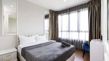 Desk, blackout drapes, iron/ironing board, bed sheets