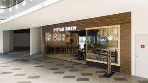 A coffee shop named 'D'Star Brew' with a modern interior, seating area, and a visible menu board. - Luxury Suite Icity Shah Alam (Shah Alam)