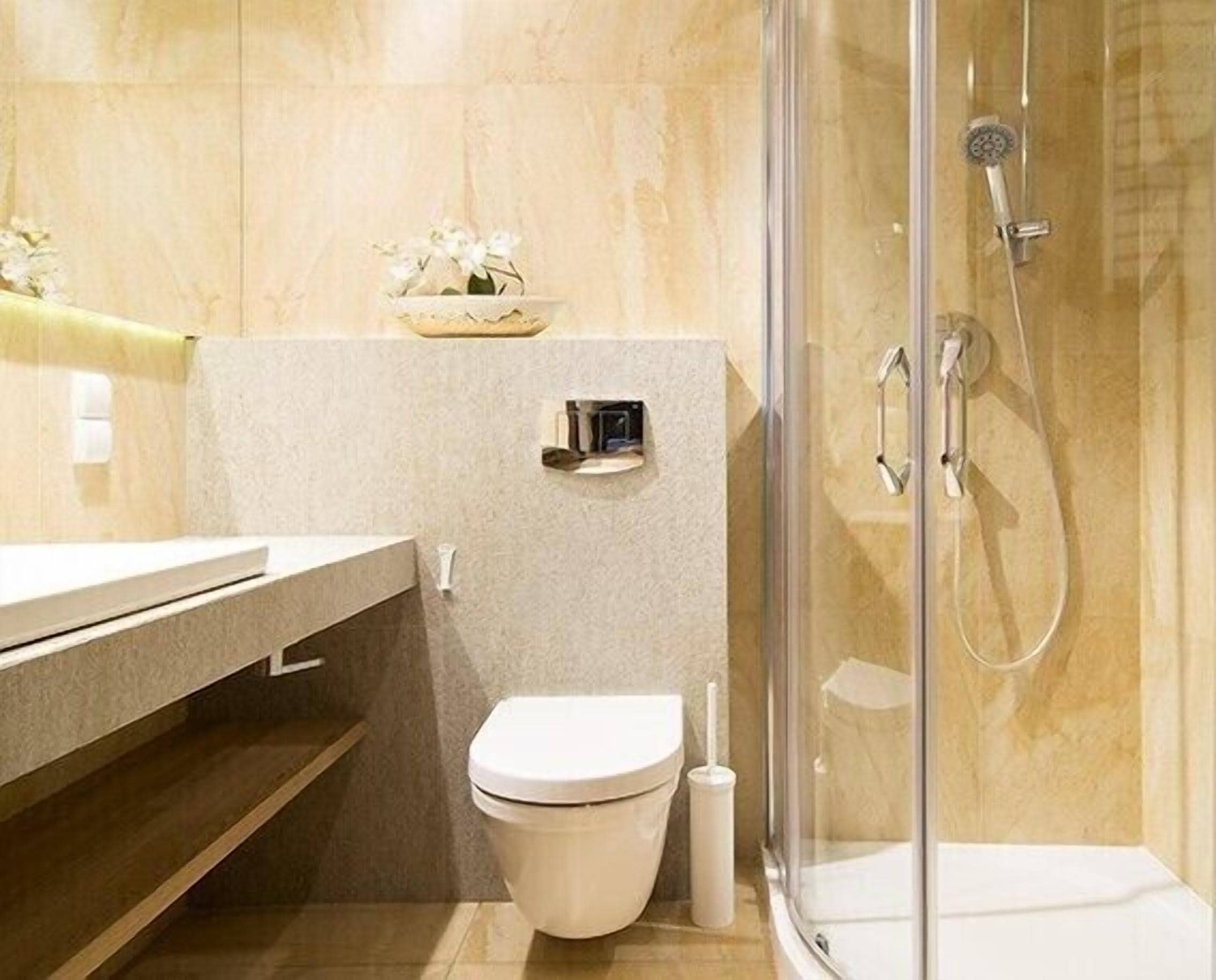 A modern bathroom with a glass-enclosed shower, a toilet, and a vanity with a sink.