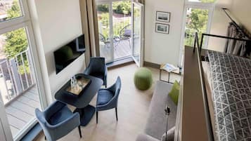Premium Studio, Balcony | Living area | 40-inch flat-screen TV with satellite channels, TV