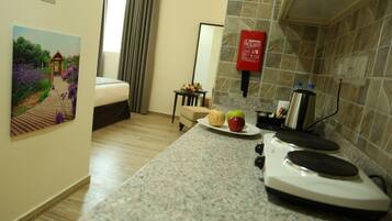 Fridge, electric kettle, cookware/dishes/utensils