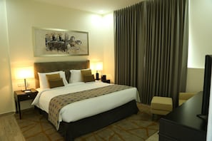 In-room safe, blackout curtains, iron/ironing board, bed sheets - The Uptown Hotel Apartment (Al-Fujairah)
