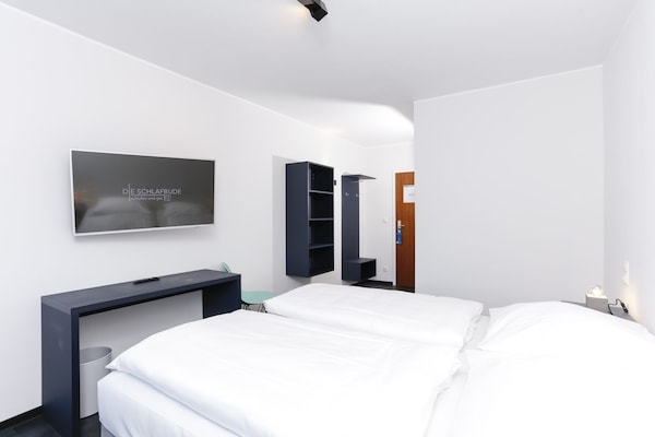 Basic Double Room | Living area | Flat-screen TV