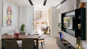 Deluxe Apartment | Living area | 45-inch flat-screen TV with premium channels, TV -  Design & Veranda next to Mahane Yehuda Market by FeelHome (Jerusalem)