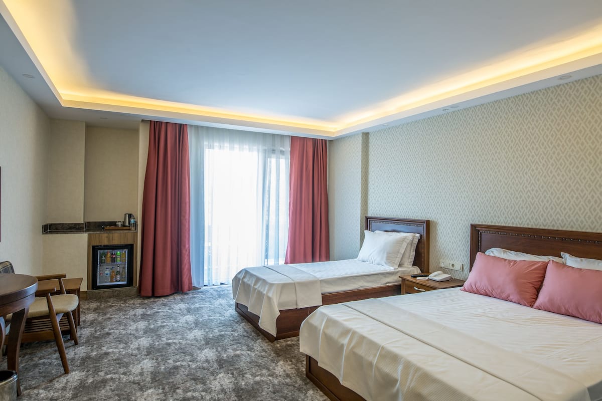 Family Triple Room, 1 Bedroom, Lanai | 1 bedroom, premium bedding, minibar, desk
