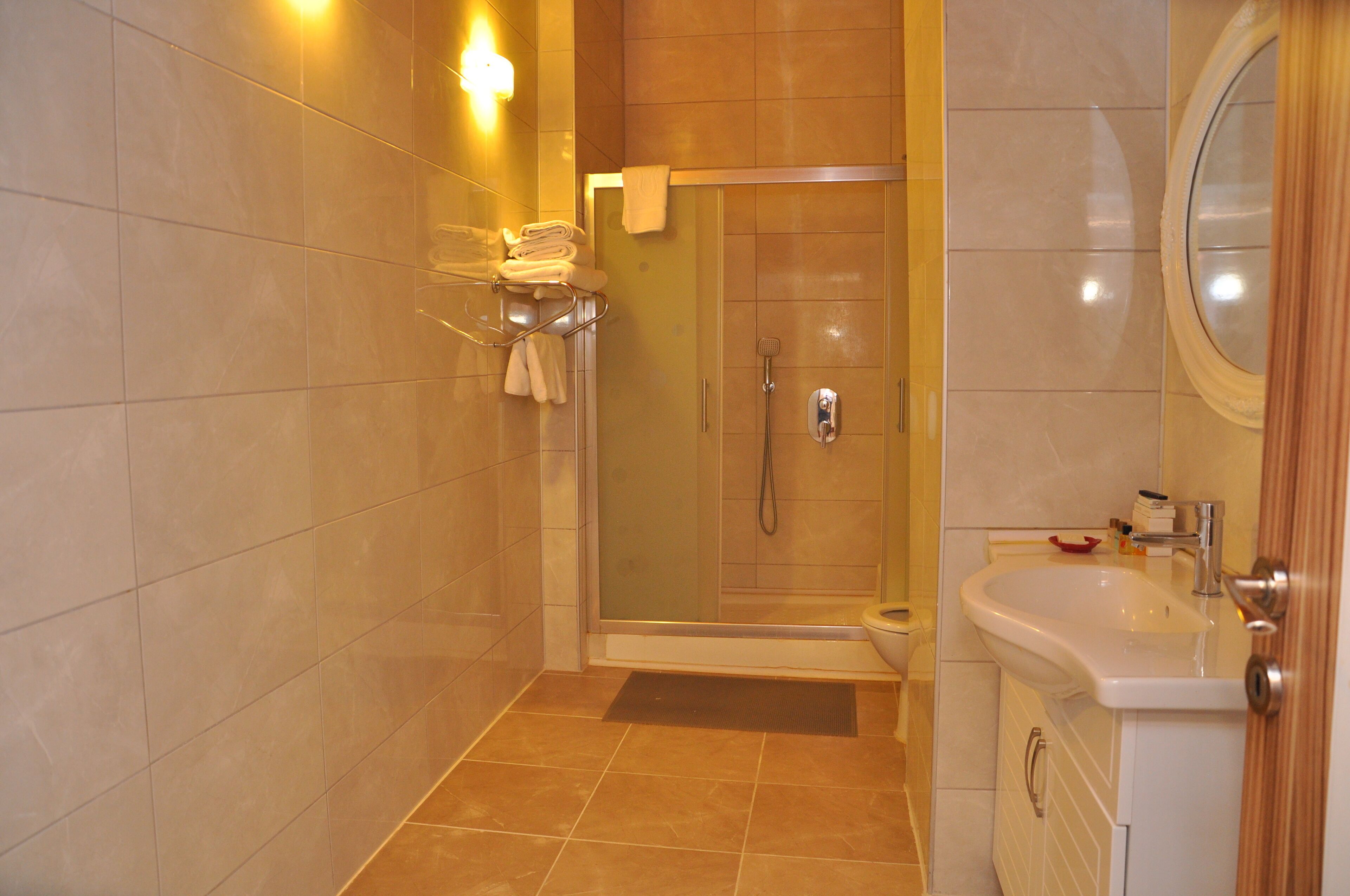 family suite, 2 bedrooms, terrace | bathroom | free toiletries, hair dryer, slippers, towels