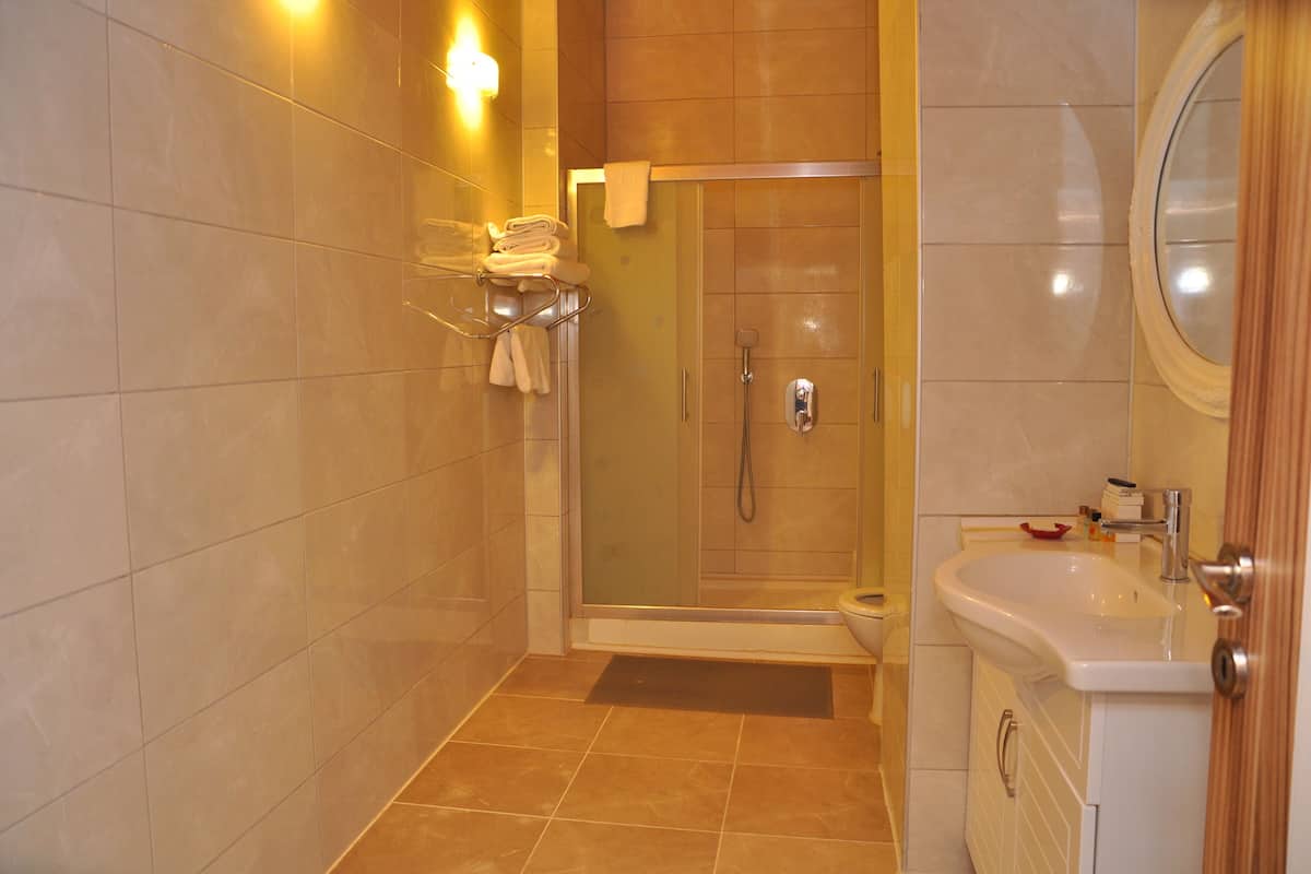 family suite, 2 bedrooms, terrace | bathroom | free toiletries, hair dryer, slippers, towels