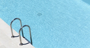 Seasonal outdoor pool, pool loungers