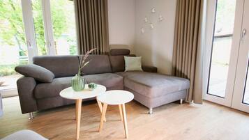 KapitÀnshaus 1 | Living area | Flat-screen TV, fireplace, DVD player