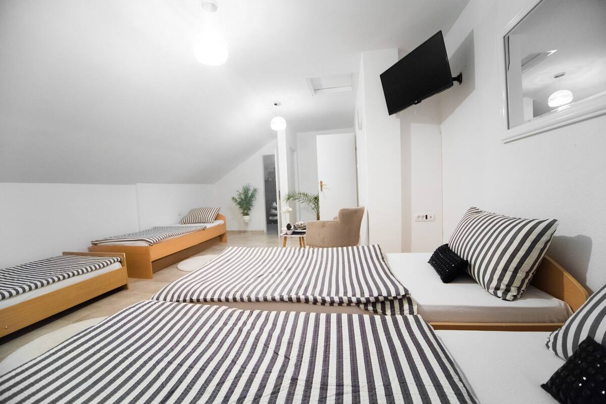 Comfort Room | Desk, laptop workspace, blackout drapes, soundproofing