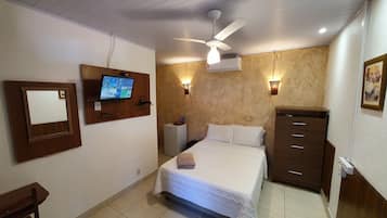 Suite ejecutiva | Minibar, escritorio, cortinas opacas y tabla de planchar con plancha