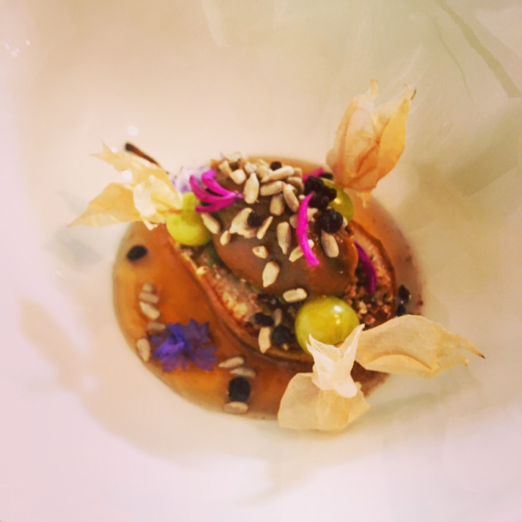 A dessert with various toppings and garnishes.