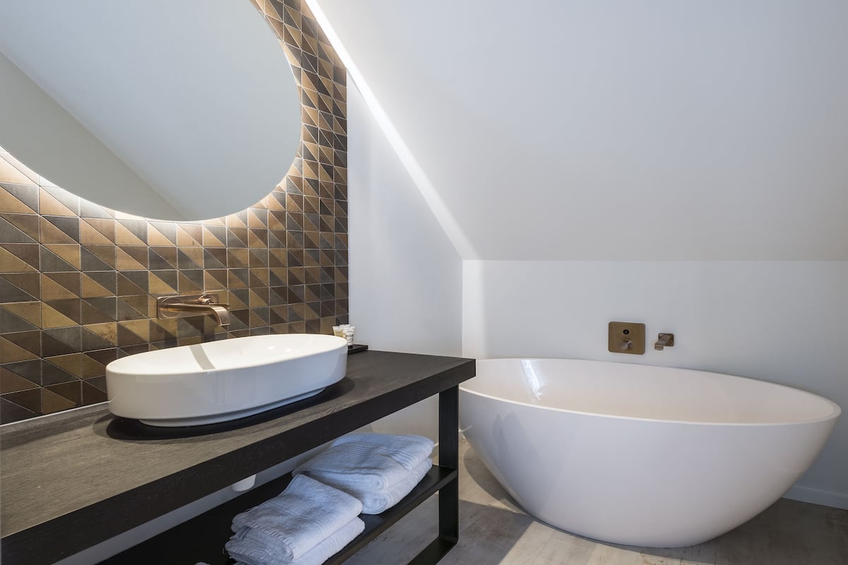 superior double room | bathroom | hair dryer, bidet, towels, soap