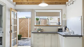 Studio Apartment | Private kitchen | Full-size fridge, microwave, oven, stovetop