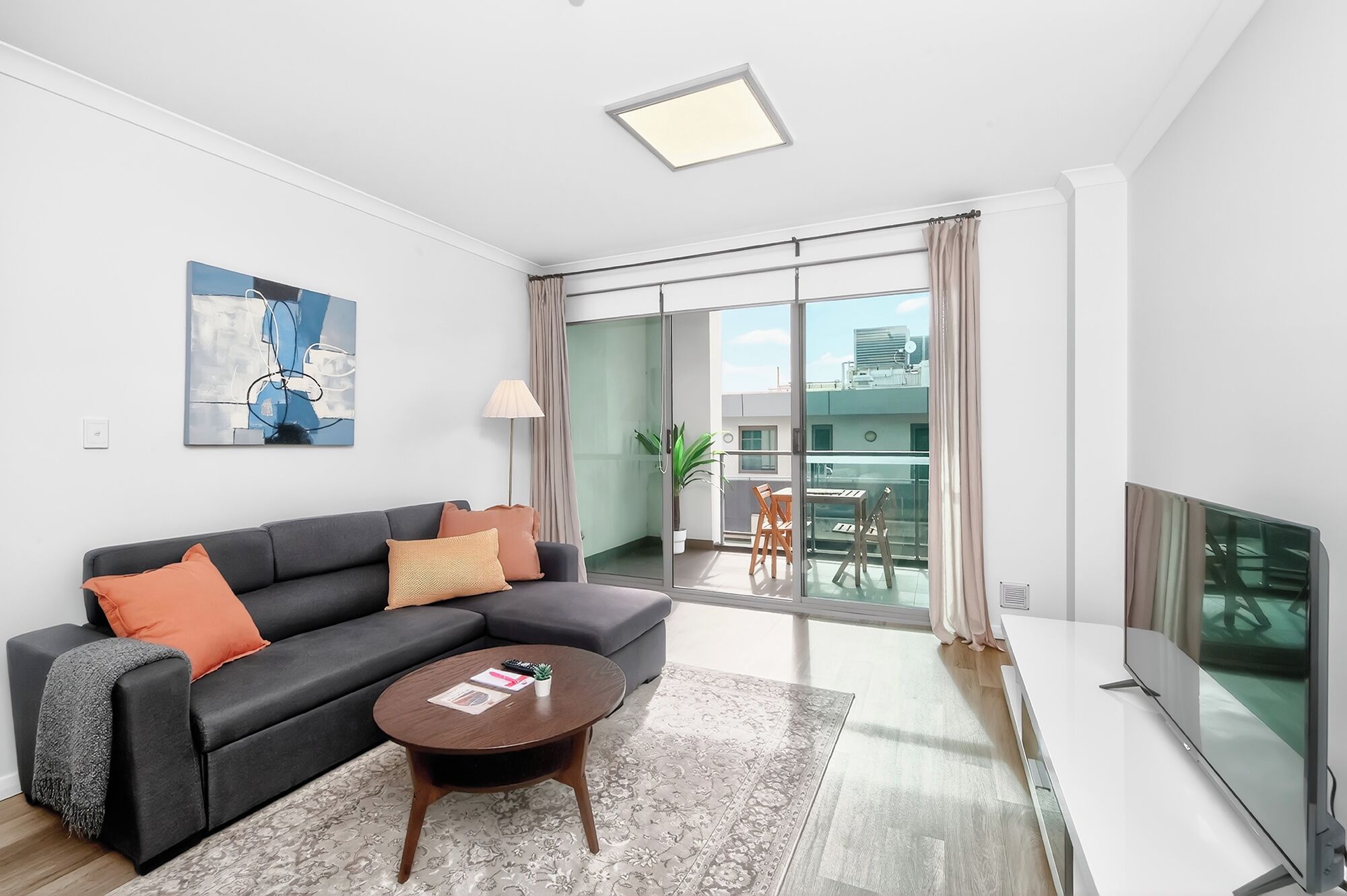Appartement Deluxe | Coin séjour | Télévision LCD, lecteur de DVD