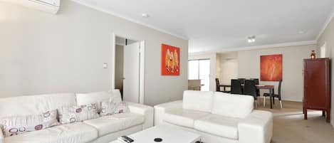 City Apartment, 2 Bedrooms | Living area | LCD TV, DVD player