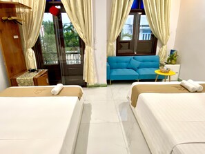 Family Room | Minibar, desk, free WiFi, bed sheets