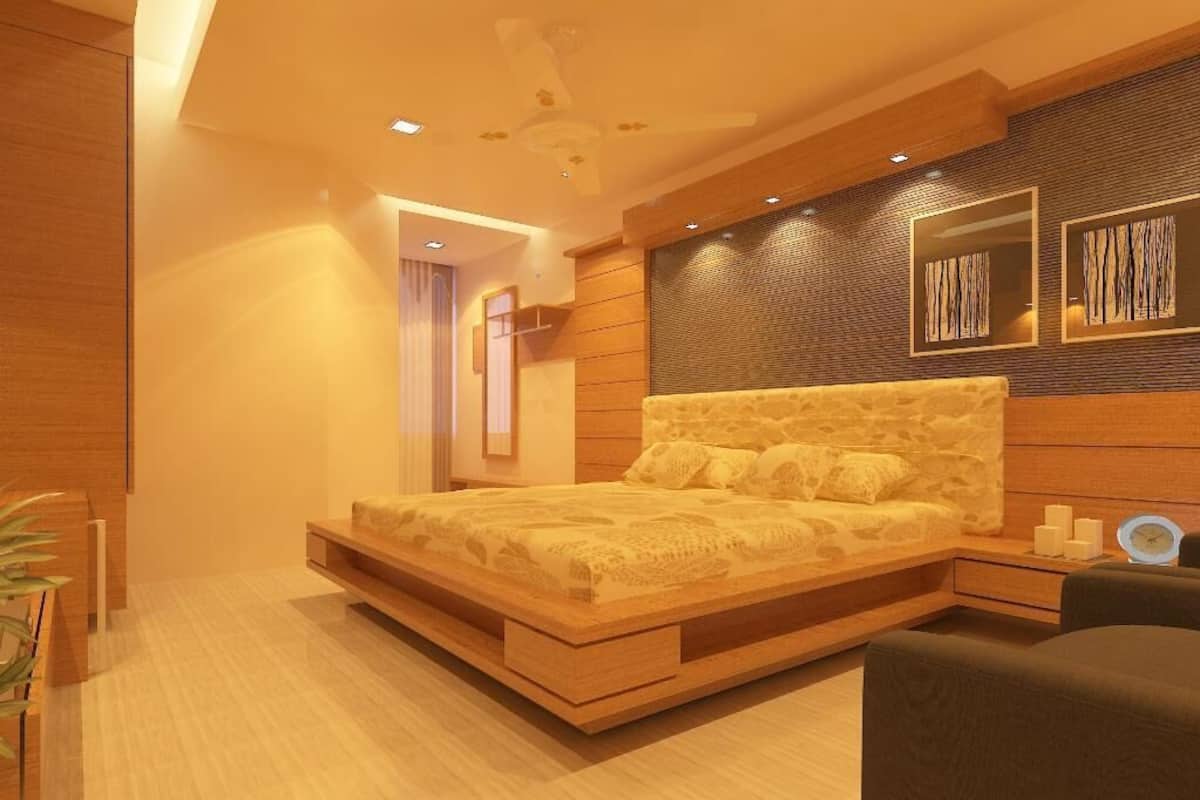 Un dormitorio moderno con una cama, mesitas de noche, un ventilador de techo y obras de arte en la pared.
