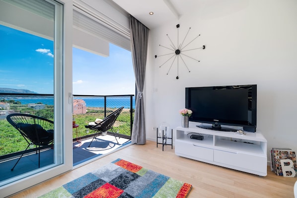 Superior Apartment | Living area | Flat-screen TV