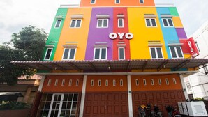 A multi-story building with a colorful facade and the name "OYO" prominently displayed.