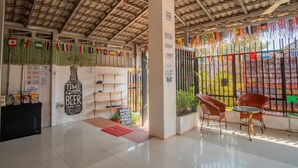 A cafe with a rustic ceiling, shelves with items, and a sign that reads "TIME WITH FRIENDS". - 333 HOSTEL, Siem Reap (Siem Reap)