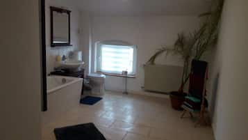 Apartment, 2 Bedrooms (Charlotte) | Bathroom | Shower, hair dryer, slippers, towels