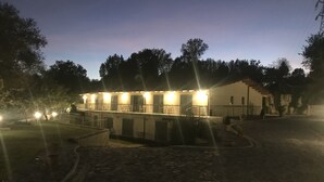 A building with multiple rooms, a courtyard, and a paved area. - Oasi del Vetoio (L'Aquila)