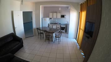 Apartment | Private kitchenette | Fridge, microwave, stovetop, cookware/dishes/utensils