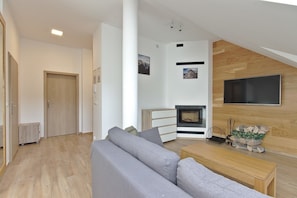 Comfort Apartment, Fireplace (Attic) | Living area | Flat-screen TV
