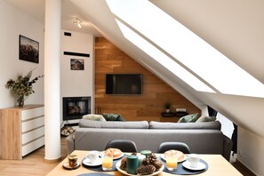 Comfort Apartment, Fireplace (Attic) | Living area | Flat-screen TV - Apartamenty Forma Tatrica (Zakopane)