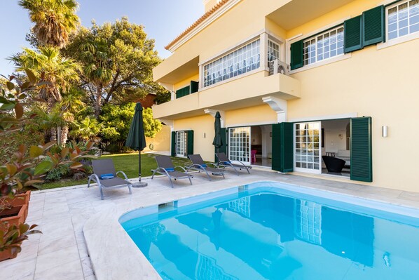 Outdoor pool, pool umbrellas, pool loungers