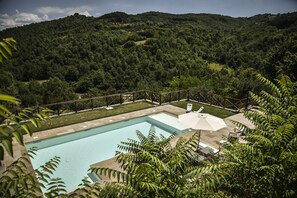 Seasonal outdoor pool, pool loungers
