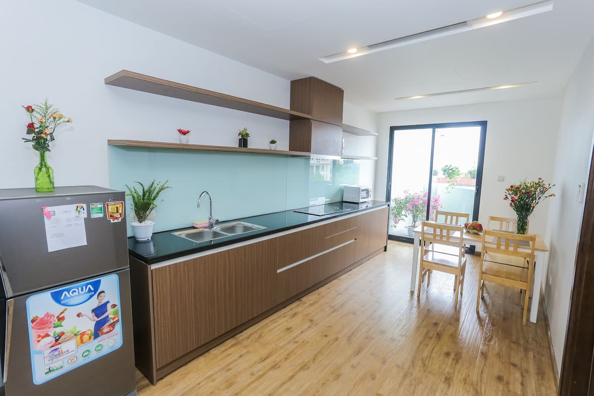 Premier Suite, 2 Bedrooms, Balcony | Private kitchen | Fridge, microwave, stovetop, electric kettle