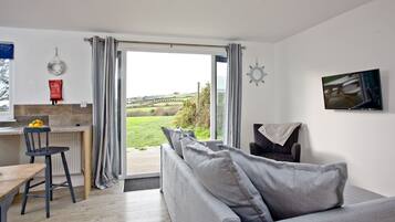 Wheal Tor - Beautifully fitted Wooden Lodge Helston | Living area | Flat-screen TV