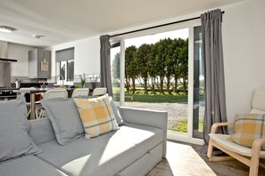 Habitación | Área de sala de estar | Televisión de pantalla plana 